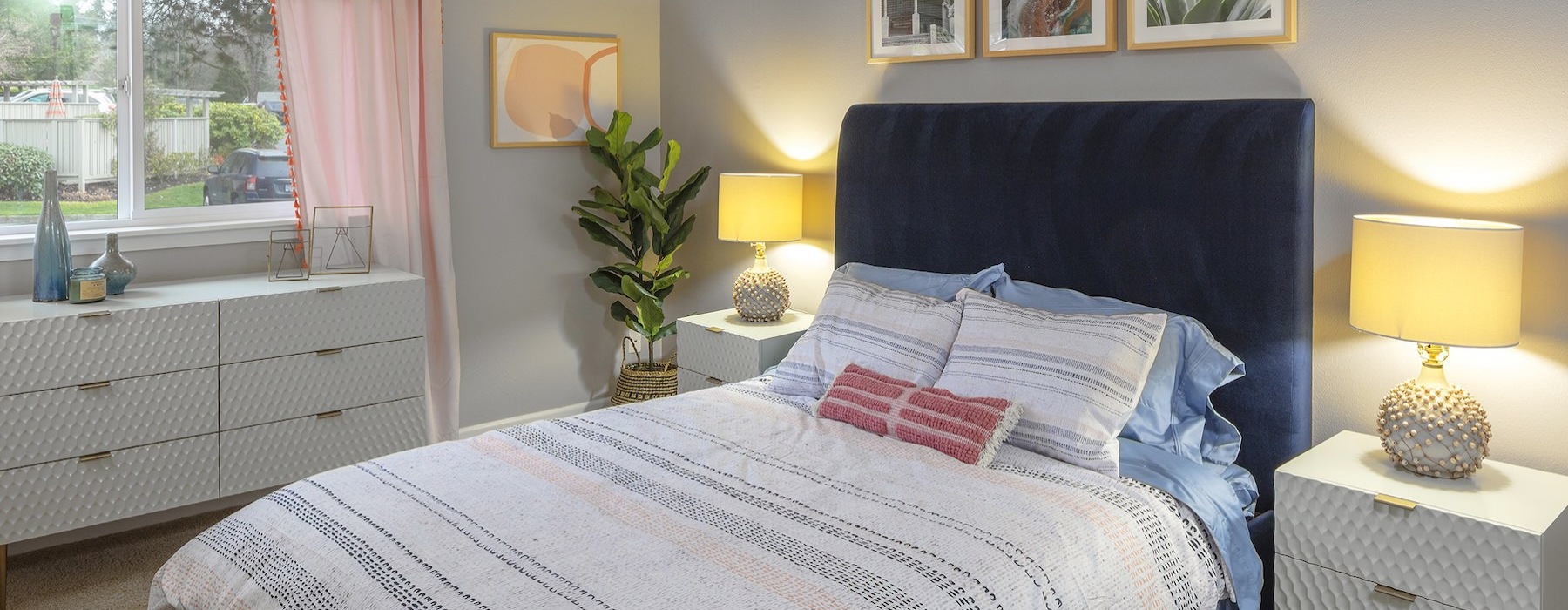 a bedroom with a bed and dressers